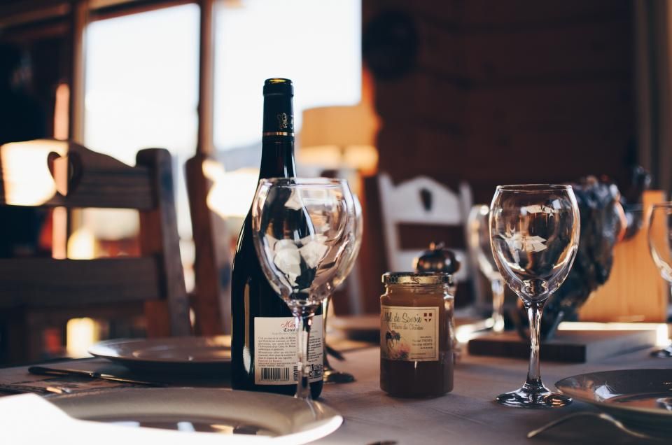 Wine glasses and bottles on the counter