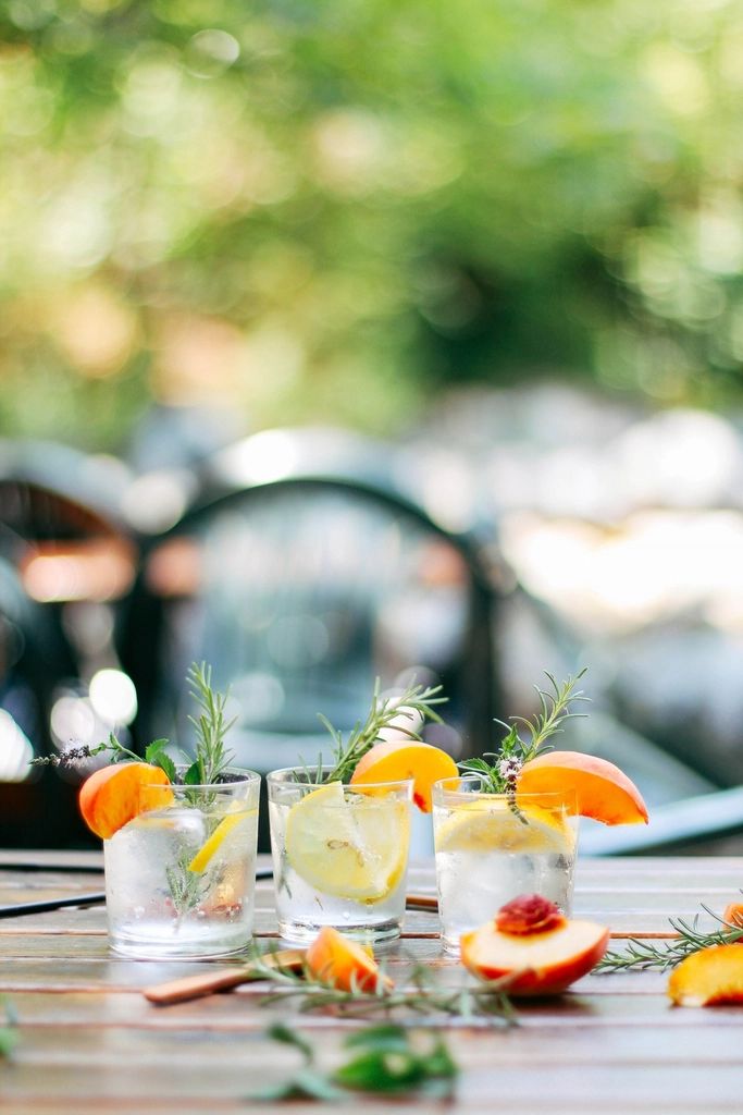 A cocktail being finished at the bar