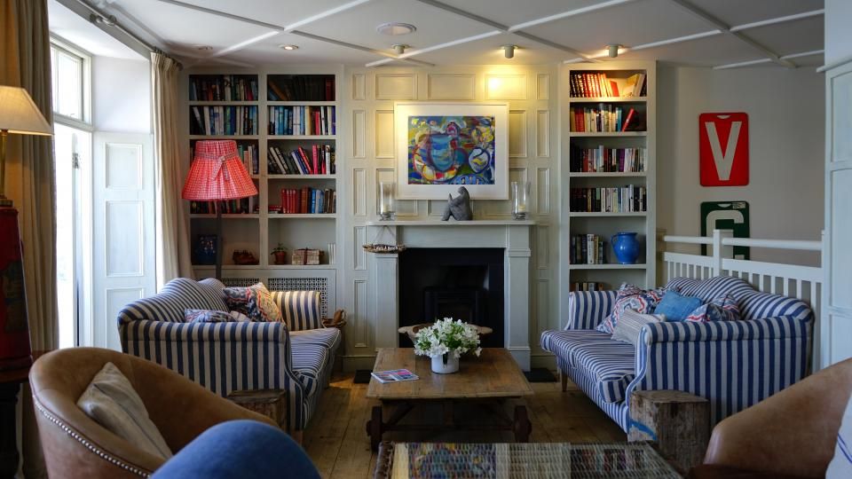 A suite sitting room with a sofa and armchairs